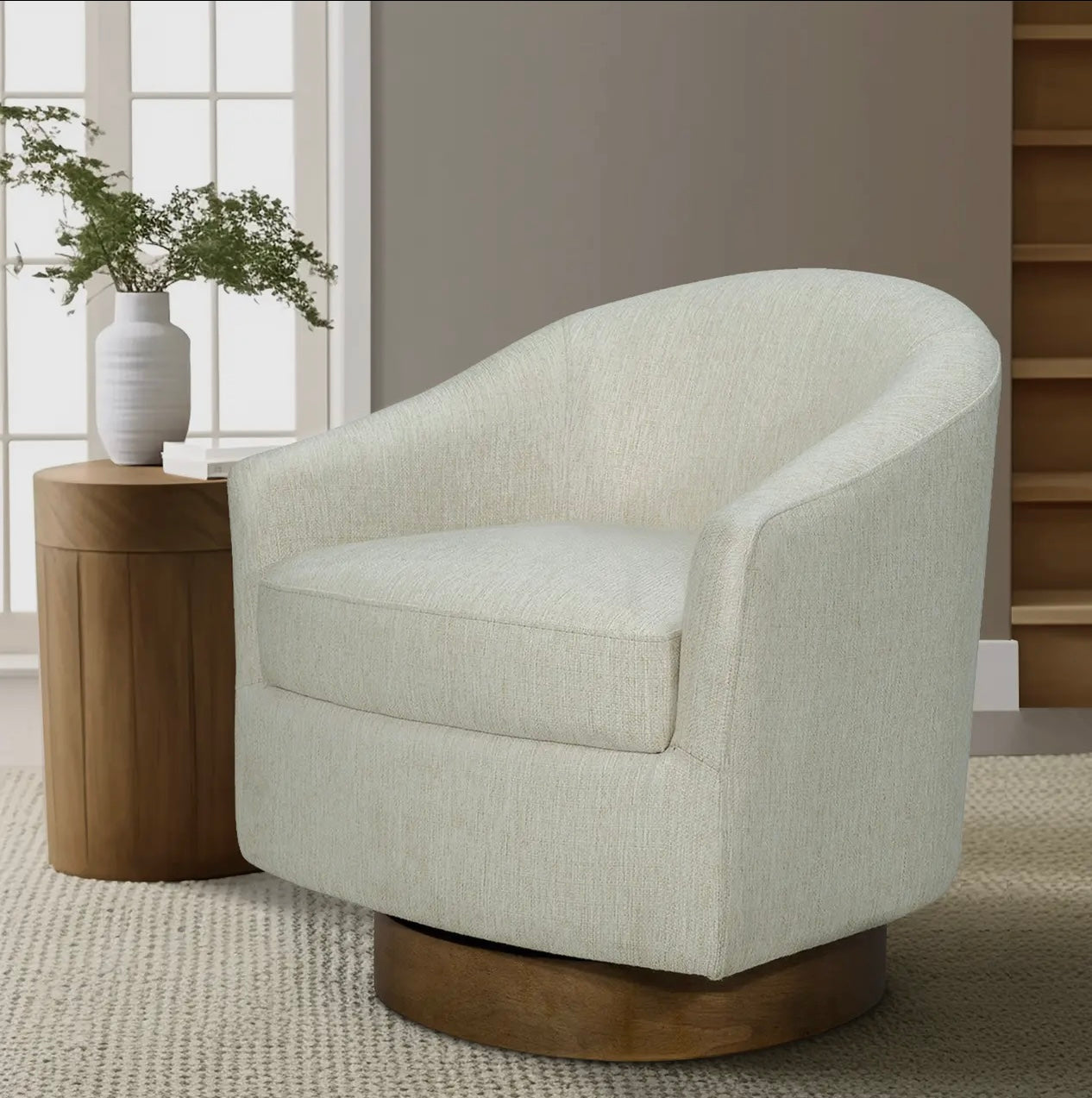 Upholstered swivel chair with wood base